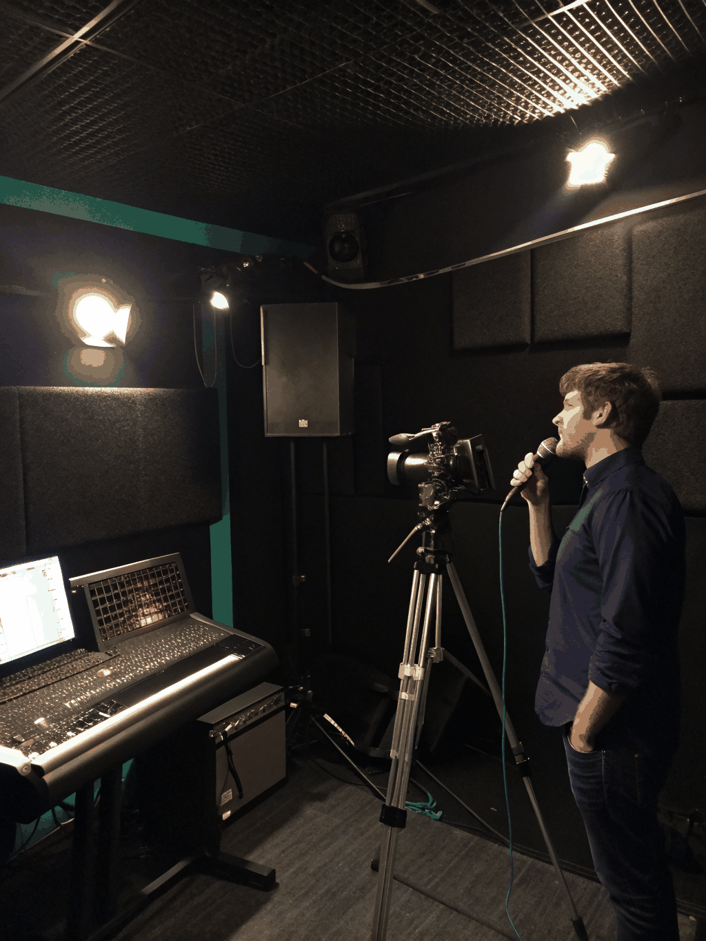 Behind the scenes recording session in a dark studio